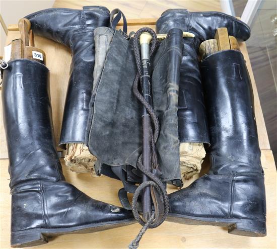 Two pairs of riding boots and trees and a stag antler handled riding crop